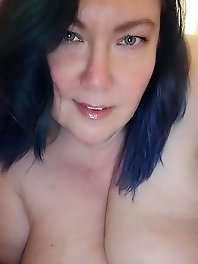 Lisa, an Essex girl, poses seductively in bedroom wearing attractive lingerie