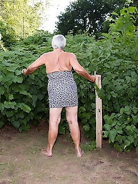 86-year-old blonde gets naked and seductive in fishnets