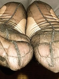 A sexy girl in high heels is working in the studio