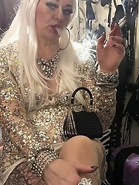 A mature woman spreads her pussy lips in captivating poses