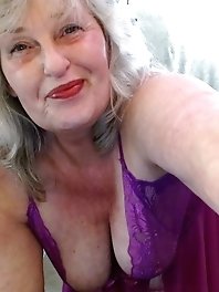 Chubby wife outdoors in the garden.